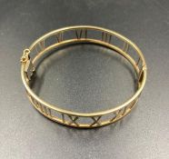 A gold bracelet marked 375 with Roman Numeral decoration (Approximate Total Weight 15.7g)