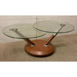 A metamorphic glass topped coffee table (H44cm Dia70cm)