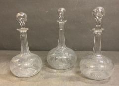 Three cut glass decanters with etched fern relief