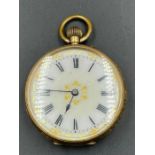 An ornate ladies pocket watch in 14ct gold