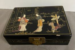 A lacquer floral and geisha's jewellery box