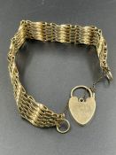 A 9ct gold gate bracelet with heart shaped fastener (Approximate 20.9)