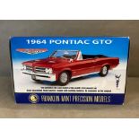 A Franklin Mint 1964 Pontiac GTO diecast model, boxed 1:24 scale