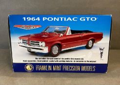 A Franklin Mint 1964 Pontiac GTO diecast model, boxed 1:24 scale