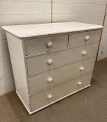 A two over three white painted chest of drawers (H90cm W106cm D54cm)
