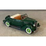 A Franklin Mint Diecast model of a 1936 Ford Cabriole