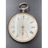 A silver pocket watch, hallmarked for London 1877.