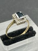A 9ct gold sapphire and diamond ring. Size R