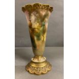 A hand painted Royal Worcester vase depicting peacocks. Stamped to base and signed by the artist