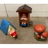 Two garden gnomes, one in the loo and one in a tent