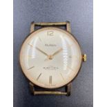 A Buren 1960's presentation, engraved watch in gold metal.