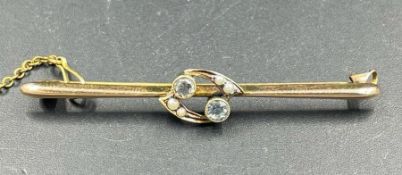 A 15ct gold and diamond brooch, with safety chain, (Approximate weight 2.6g)