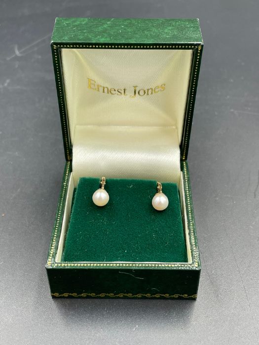 A pair of 9ct gold and pearl earrings