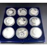A selection of nine collectable silver coins in Infobank presentation box