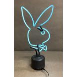 A Neon playboy bunny desk light