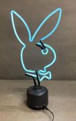 A Neon playboy bunny desk light
