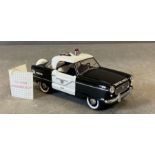 A Franklin Mint Diecast model of a 1956 Nash Metropolitan