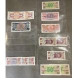 A selection of fourteen mint British Armed Forces bank notes