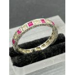 A 9ct gold ring AF with diamond and rubies. Size O