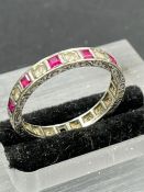 A 9ct gold ring AF with diamond and rubies. Size O