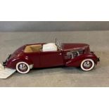 A Franklin Mint Diecast model of a 1937 812 Phaeton Coupe