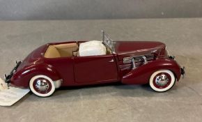 A Franklin Mint Diecast model of a 1937 812 Phaeton Coupe