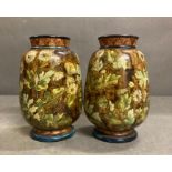 A pair of Lambeth Doulton Faience stoneware vase, approximately 16 cm High.