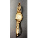 A Ladies 18ct gold watch on a 9ct gold extendable bracelet (Approximate Total Weight 14.4g)