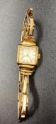 A Ladies 18ct gold watch on a 9ct gold extendable bracelet (Approximate Total Weight 14.4g)