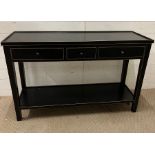 A black classic console table with drawers and shelf under and lip to top (H77cm W122cm D41
