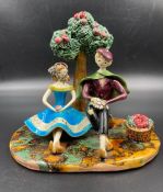 A Neuquelman of Paris figurine of a couple under an apple tree AF