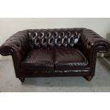Two seater brown Chesterfield sofa
