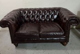 Two seater brown Chesterfield sofa