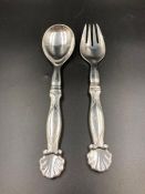 A pair of silver Georg Jensen silver salad servers.