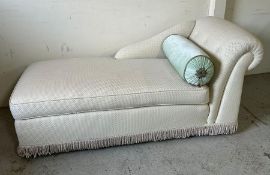 An upholstered day bed with bolster cushions (H84cm W183cm D85cm)
