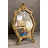A wooden framed painted dressing table mirror