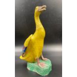 An early 20th Century Chinese glazed yellow ceramic duck marked to base
