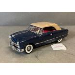 A Franklin Mint Diecast model of a 1949 Ford Convertible