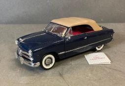A Franklin Mint Diecast model of a 1949 Ford Convertible