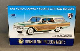 A Franklin Mint Diecast model of a Ford Country Squire Station Wagon