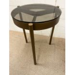 A metal tripod table with smoked glass top by Selva Piccadilly (Dia 40cm H57cm)
