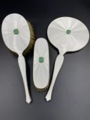 A Z Barraclough & Sons Ltd (Leeds) silver, enamel and dressing table set comprising two brushes