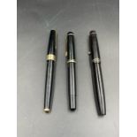 Three fountain pens, Parker 17, Parker Victory and a Swan