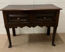 A George III style oak side table with two drawers with shaped apron on cabriole legs (H84cm