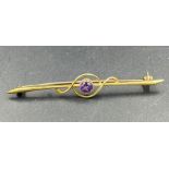 A 9ct gold brooch with amethyst