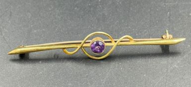A 9ct gold brooch with amethyst