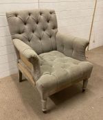 A contemporary French style button back arm chair with hessian detail to back and sides