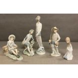 A selection of five Lladro figures to include a boy fishing and Don Quixote