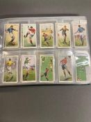 Three albums of players cigarette cards