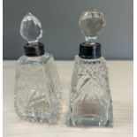 Two cut glass scent bottles with silver collars